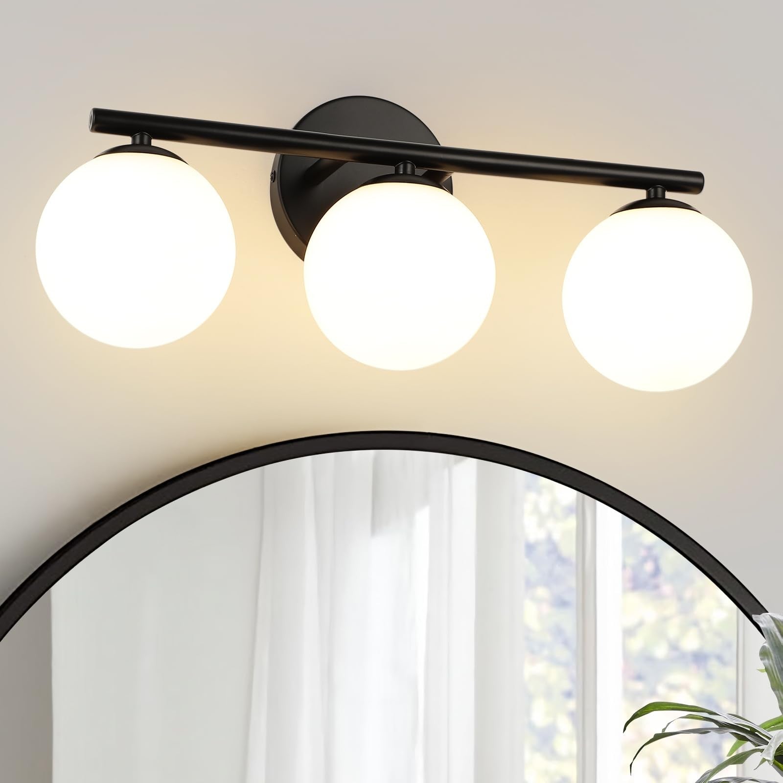 Foucasal black globe bathroom light fixture with three plastic globe shades, vanity lighting for modern bathroom decor.