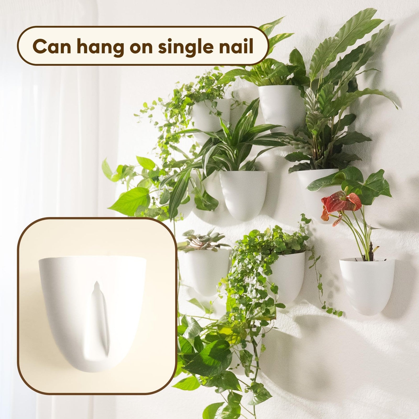 Make Good PlantPod Classic self-watering wall planter with white finish, holding indoor green plants for vertical garden display.