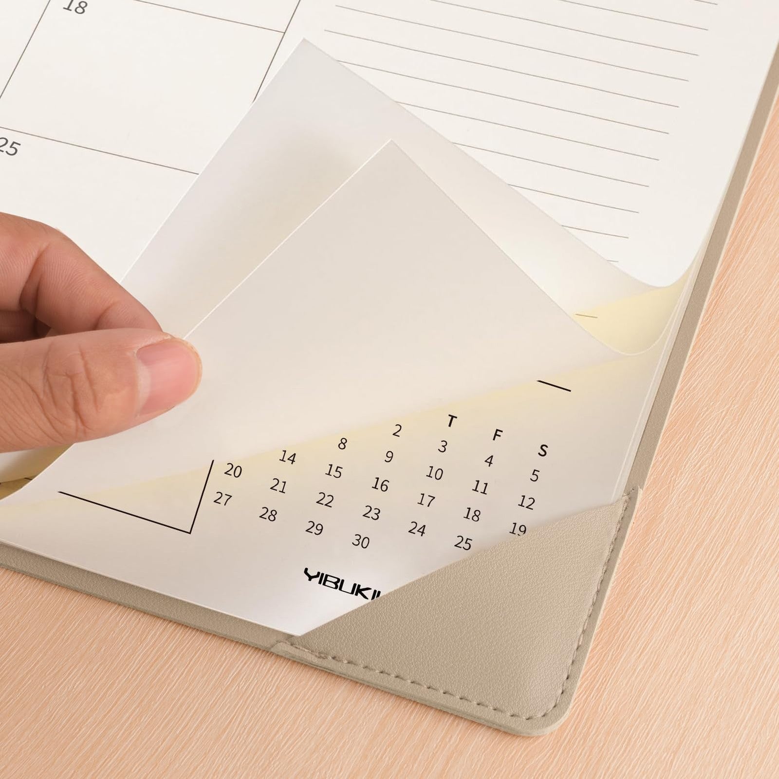 YIBUKIU desk calendar 2026-2027, large 22x17 inch size, showing months from January 2026 to June 2027 with colorful pages.
