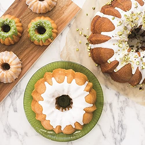 Nordic Ware Platinum Collection 6-cup Bundt pan with intricate floral design, made of durable metal for baking decorative cakes.