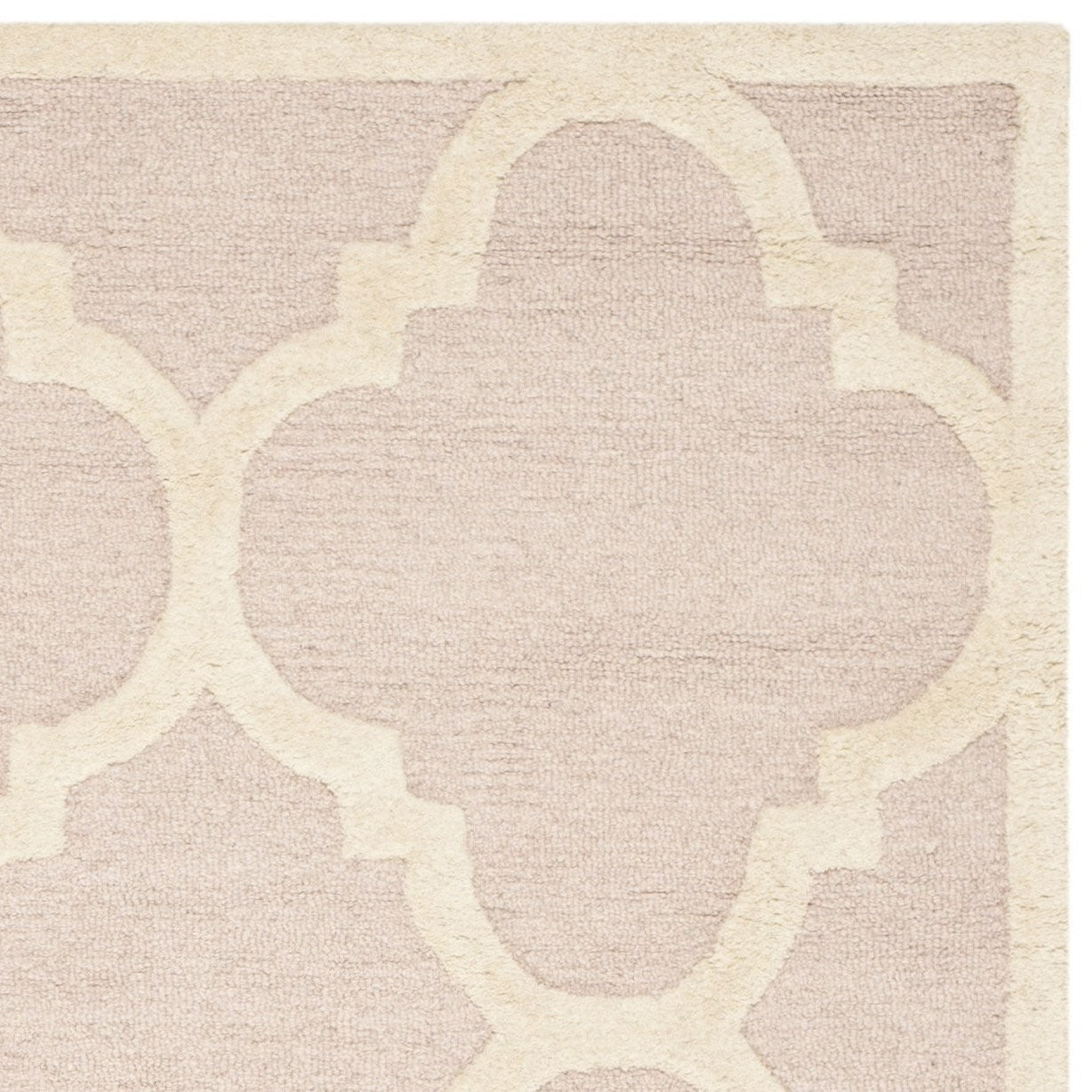 Handmade Safavieh Cambridge Collection 6x9 rug with light pink and ivory geometric pattern, crafted for elegant home decor.