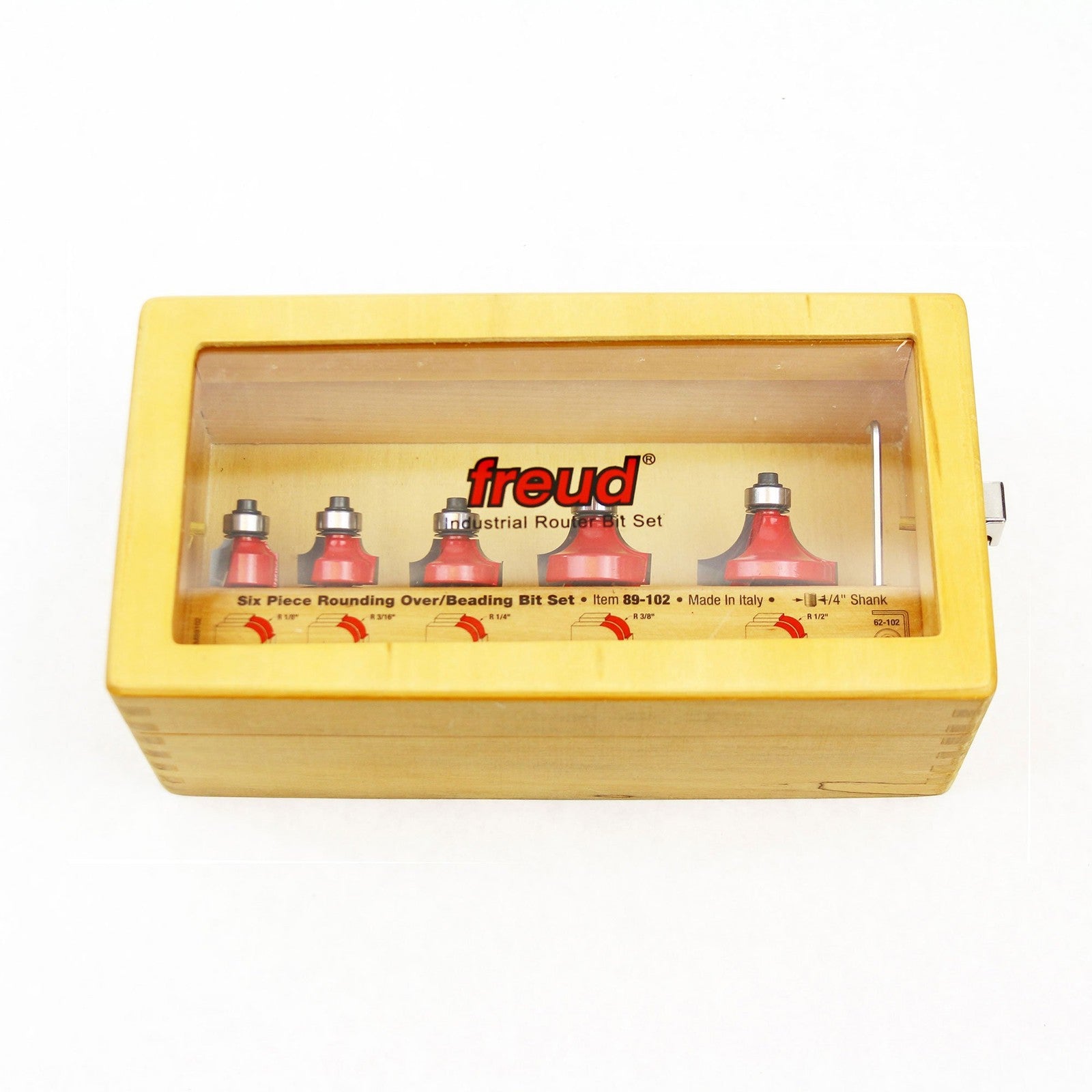 Freud 89-102 5-piece round over and beading router bit set with 1/4-inch shank, displayed with various bits on a workbench.