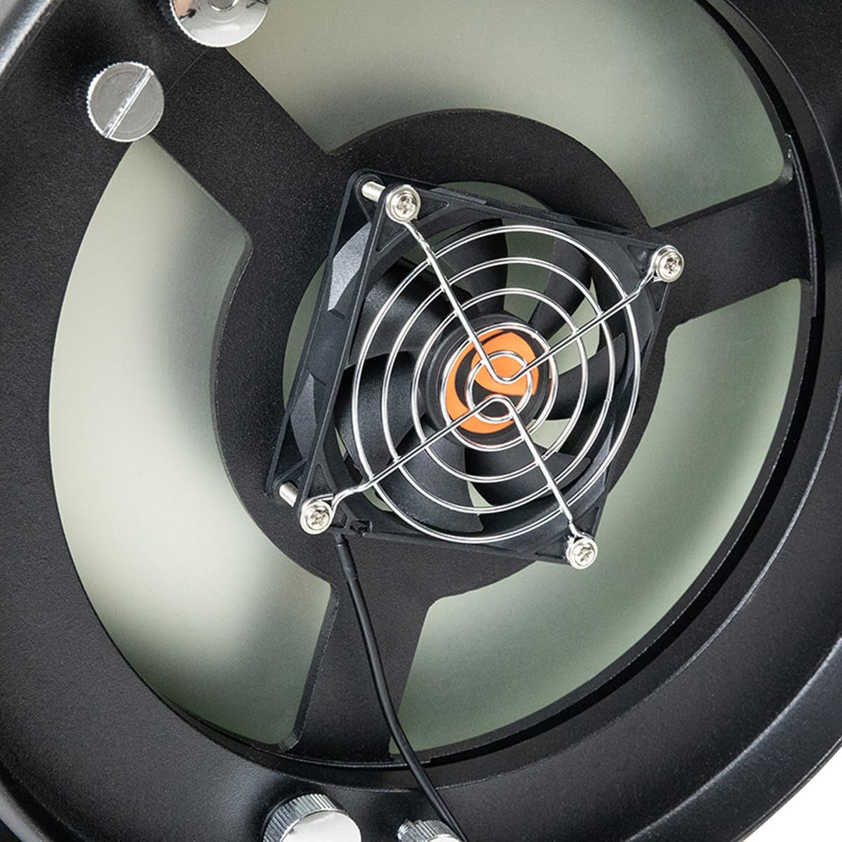 Celestron USB cooling fan attached to a Dobsonian telescope for improved cooling and optimal viewing conditions.