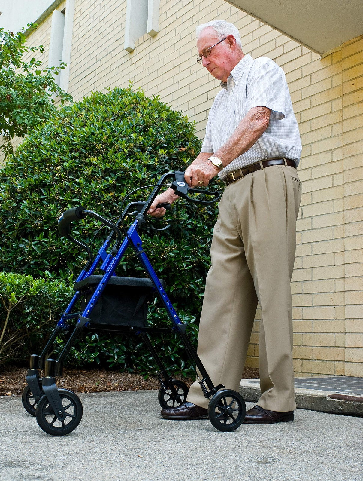 Adjustable Graham-Field Lumex Set N Go Rollator with four wheels, padded seat, and handlebars for easy mobility assistance.