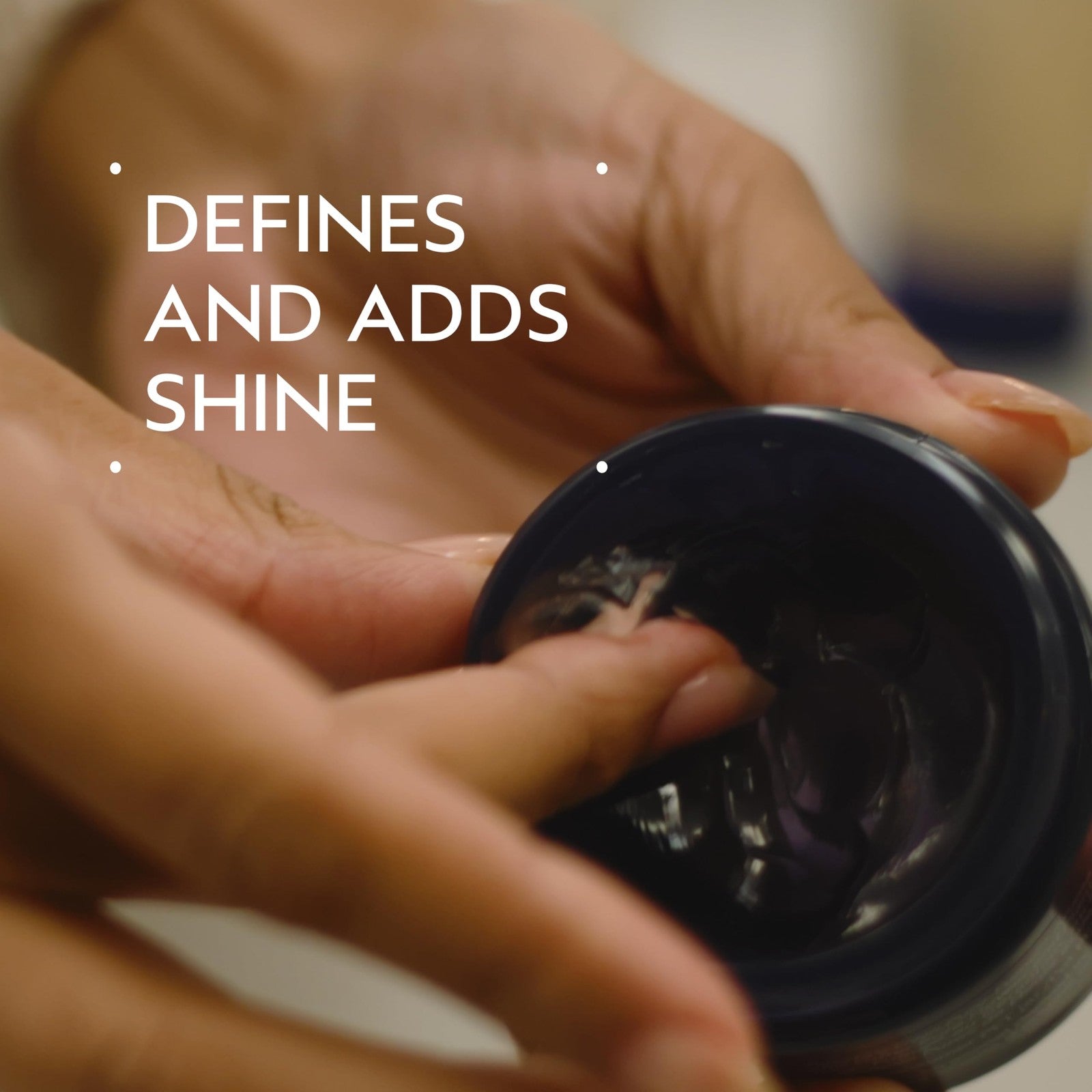 Aveda Brilliant Humectant Pomade enhancing curls, adding shine and definition to hair with a smooth, natural finish.