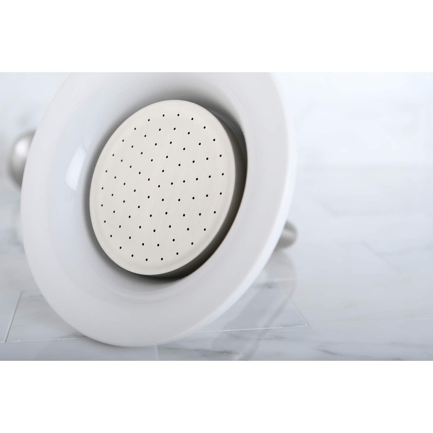 Kingston Brass Victorian P60SN round raindrop ceramic shower head with multiple spray nozzles, polished chrome finish.