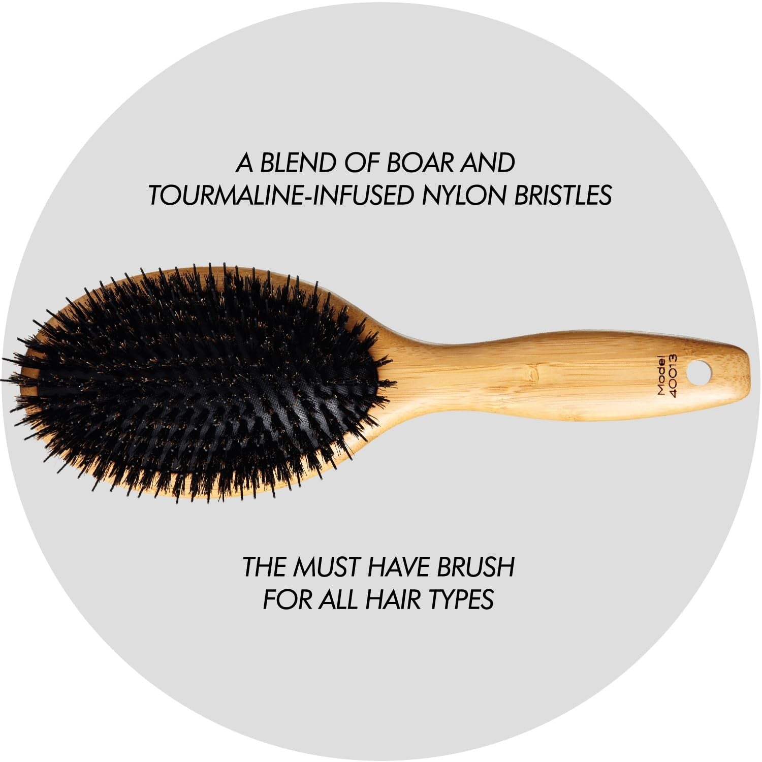Sam Villa Signature Series boar bristle hair brush for styling, with natural boar bristles and ergonomic handle.
