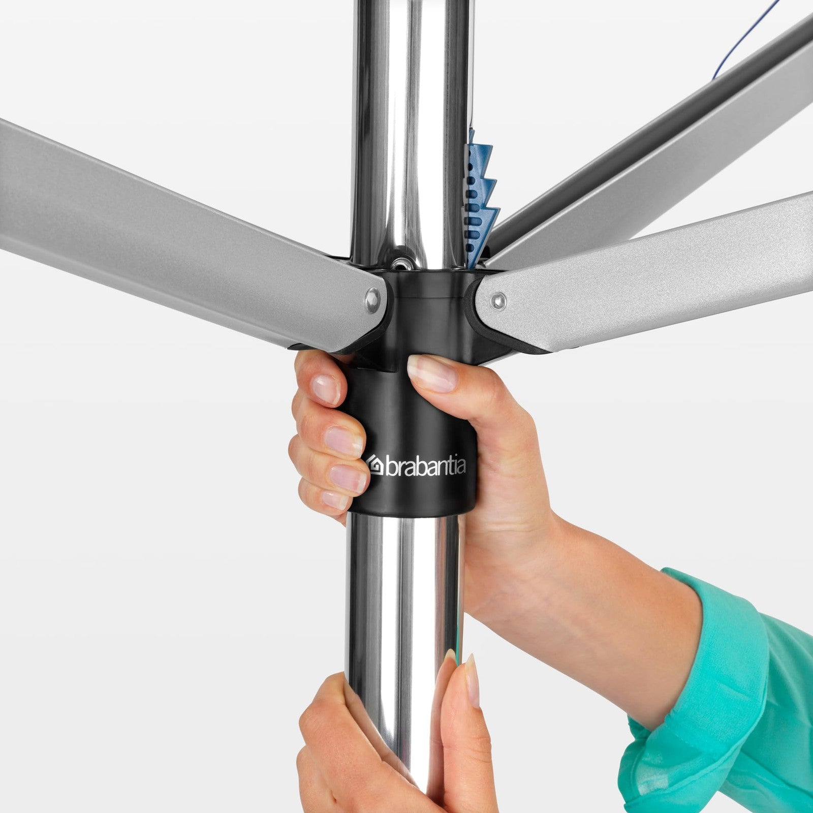 Brabantia Topspinner 4-arm outdoor clothesline with 197ft of drying space, featuring a rotating and folding design for outdoor clothes drying.