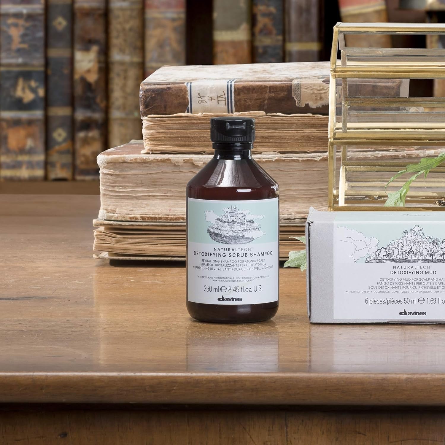 Davines Naturaltech Detoxifying Scrub Shampoo with natural ingredients, showing the bottle and shampoo texture on a white background.