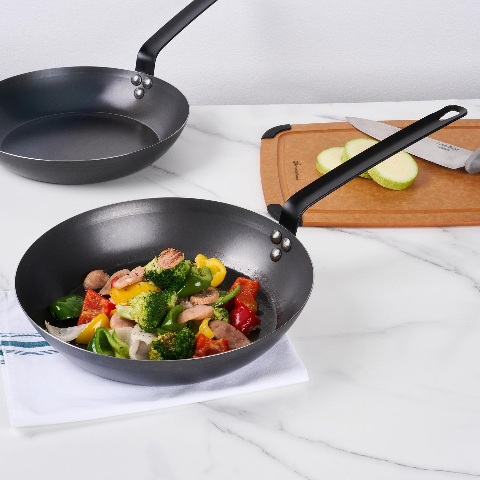 Restaurantware Met Lux 12-inch lightweight frying pan with triple-rive design, induction-ready cookware for versatile kitchen use.