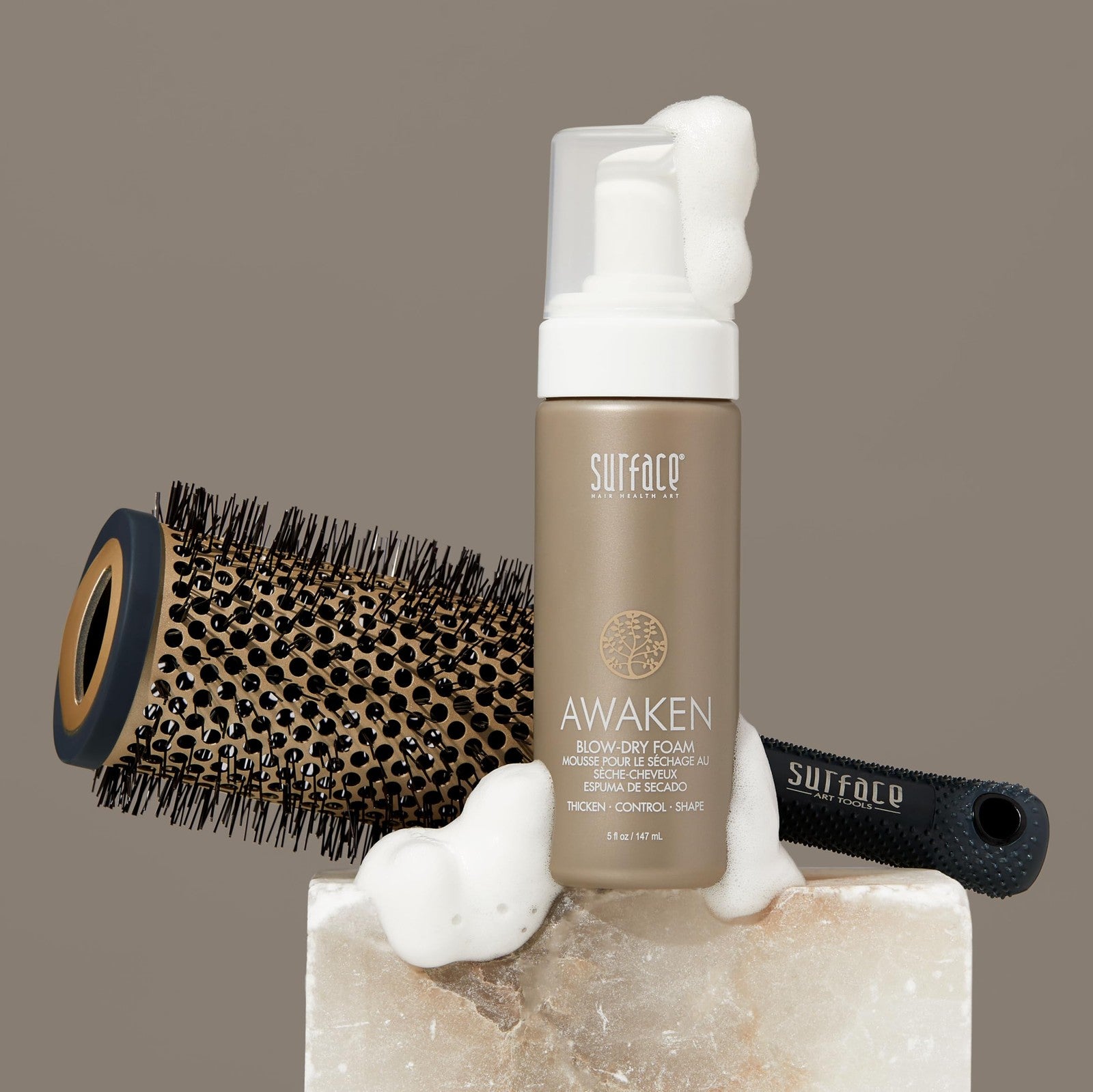 SURFACE Hair Awaken Thickening Blow Dry Foam bottle with a pump, designed to protect and strengthen fine, fragile hair.