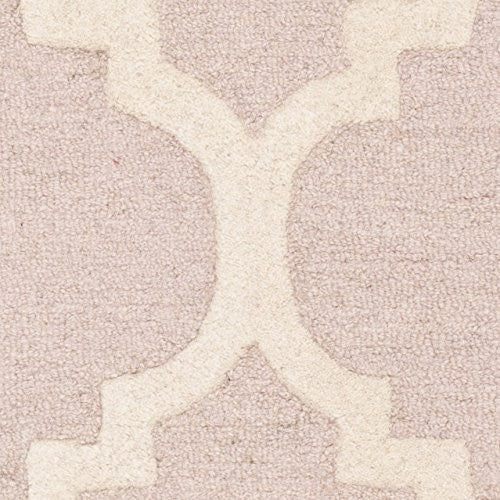 Handmade Safavieh Cambridge Collection 3x5 rug in light pink and ivory with intricate patterns and soft texture.