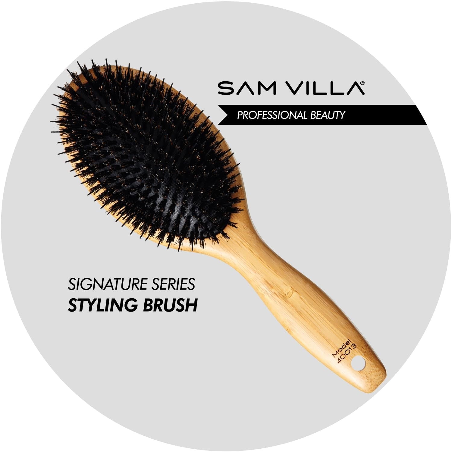 Sam Villa Signature Series boar bristle hair brush for styling, with natural bristles and ergonomic handle for smooth hair grooming.