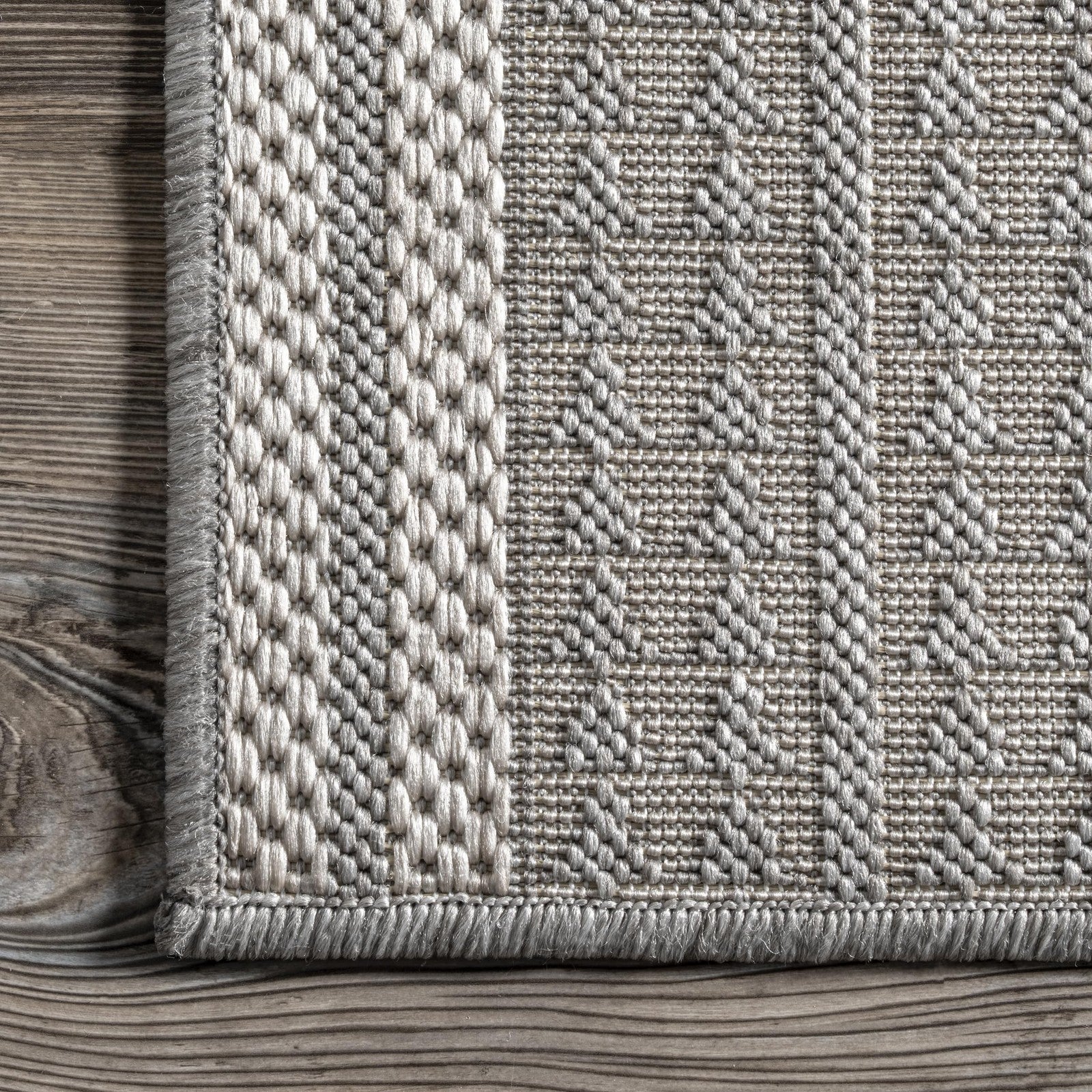 nuLOOM Ranya tribal geometric rug in light grey and ivory, showcasing soft, cozy fibers and a modern tribal design in 36x5 size.