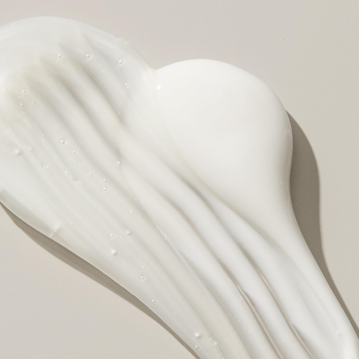 UNITE Hair U:LUXURY Hydrating Shampoo bottle with label, designed to strengthen and repair hair, in a sleek white and gold packaging