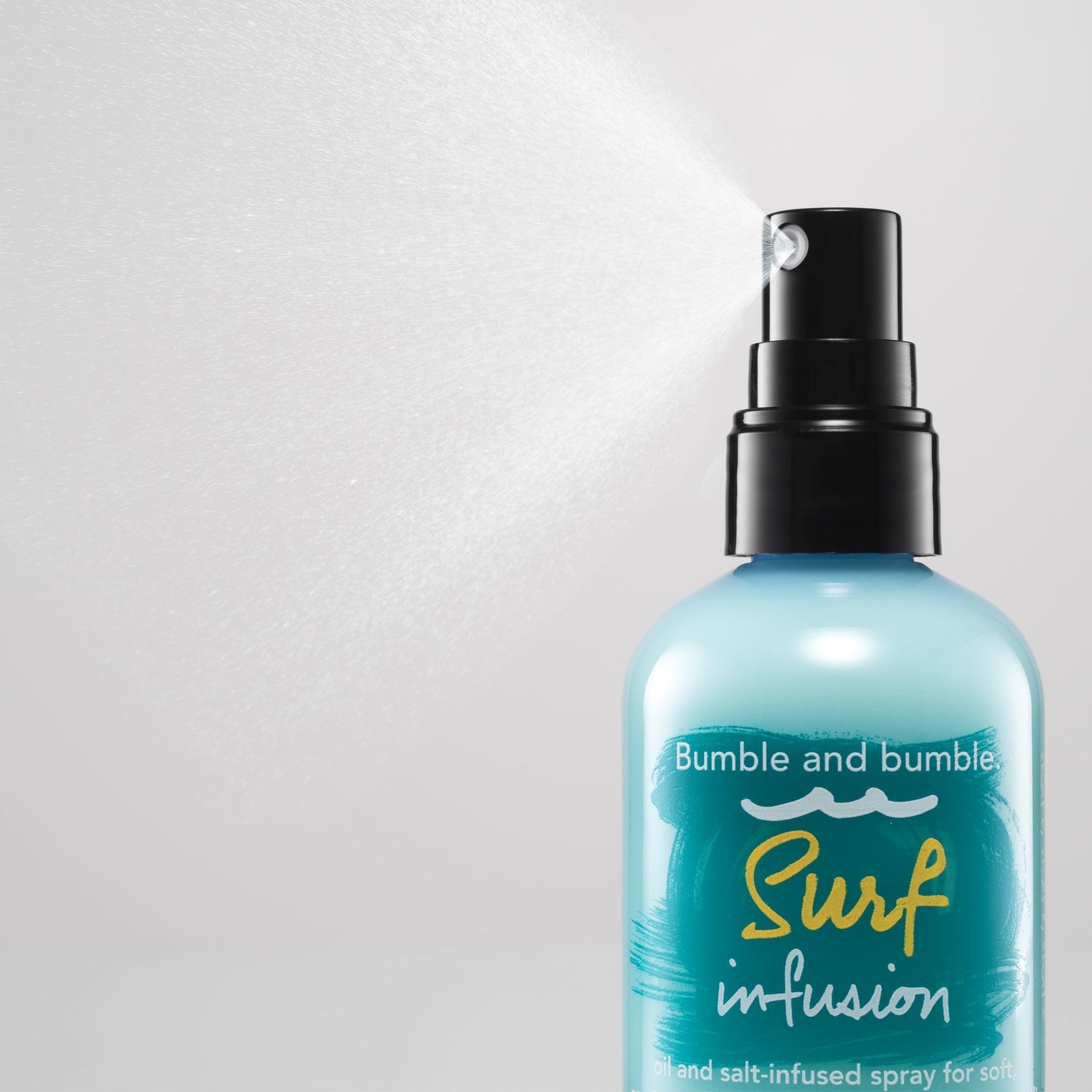 Bumble and bumble Surf Infusion Sea Salt Spray bottle for adding texture and beachy waves to hair, with conditioning benefits.