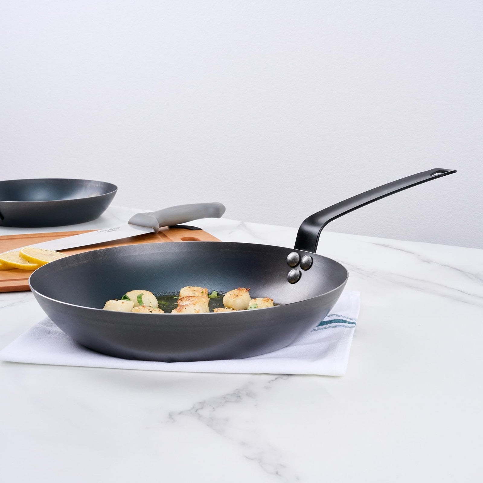 Restaurantware Met Lux 11-inch lightweight frying pan with triple-rive design, induction-ready cookware for versatile kitchen use.