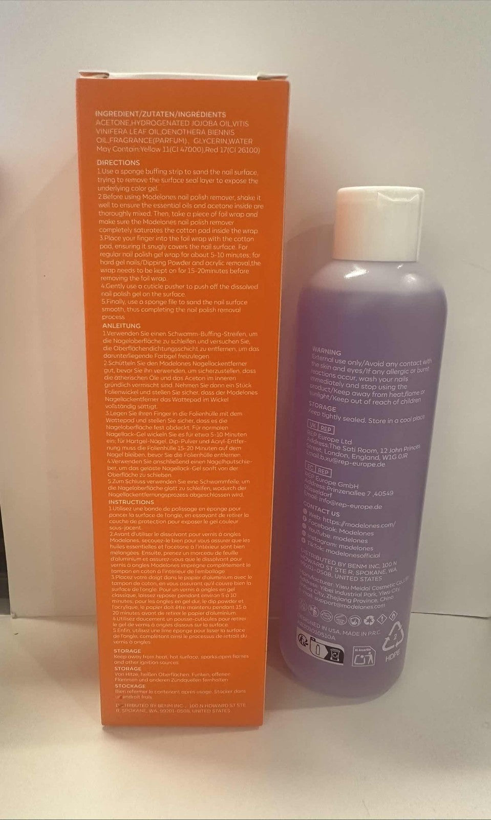 Unbranded Modelones acetone nail polish remover with red orange sky design, showing the bottle and label.