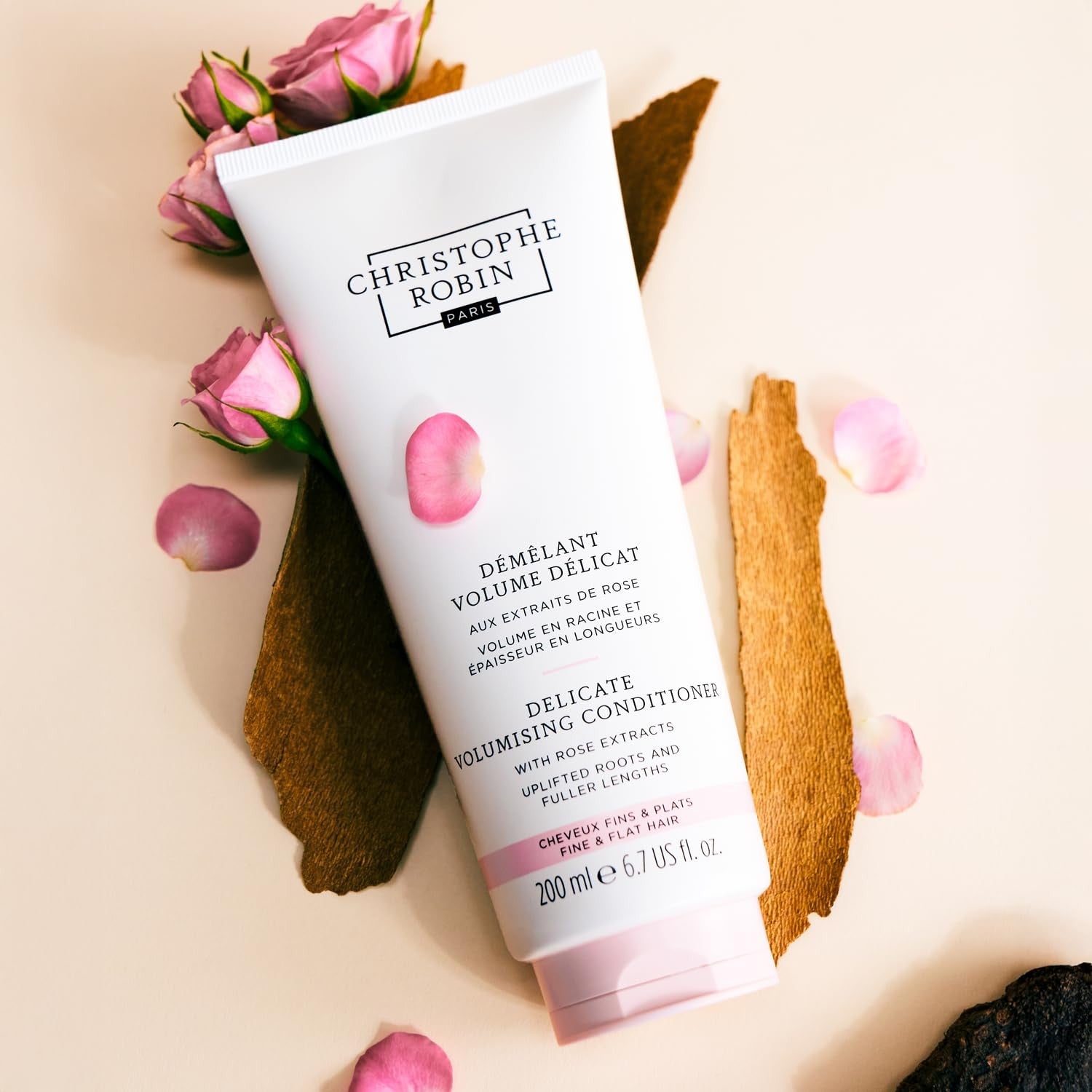 Christophe Robin Delicate Volumizing Conditioner with Rose Extracts for thin, fine hair, shown in a sleek white bottle.