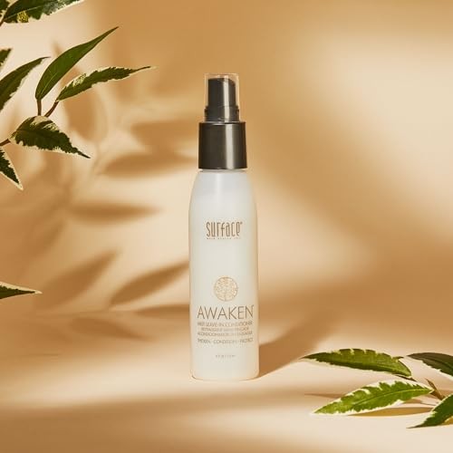 SURFACE Hair Awaken Mist leave-in conditioner and detangler, showing a spray bottle with clear liquid and product label.