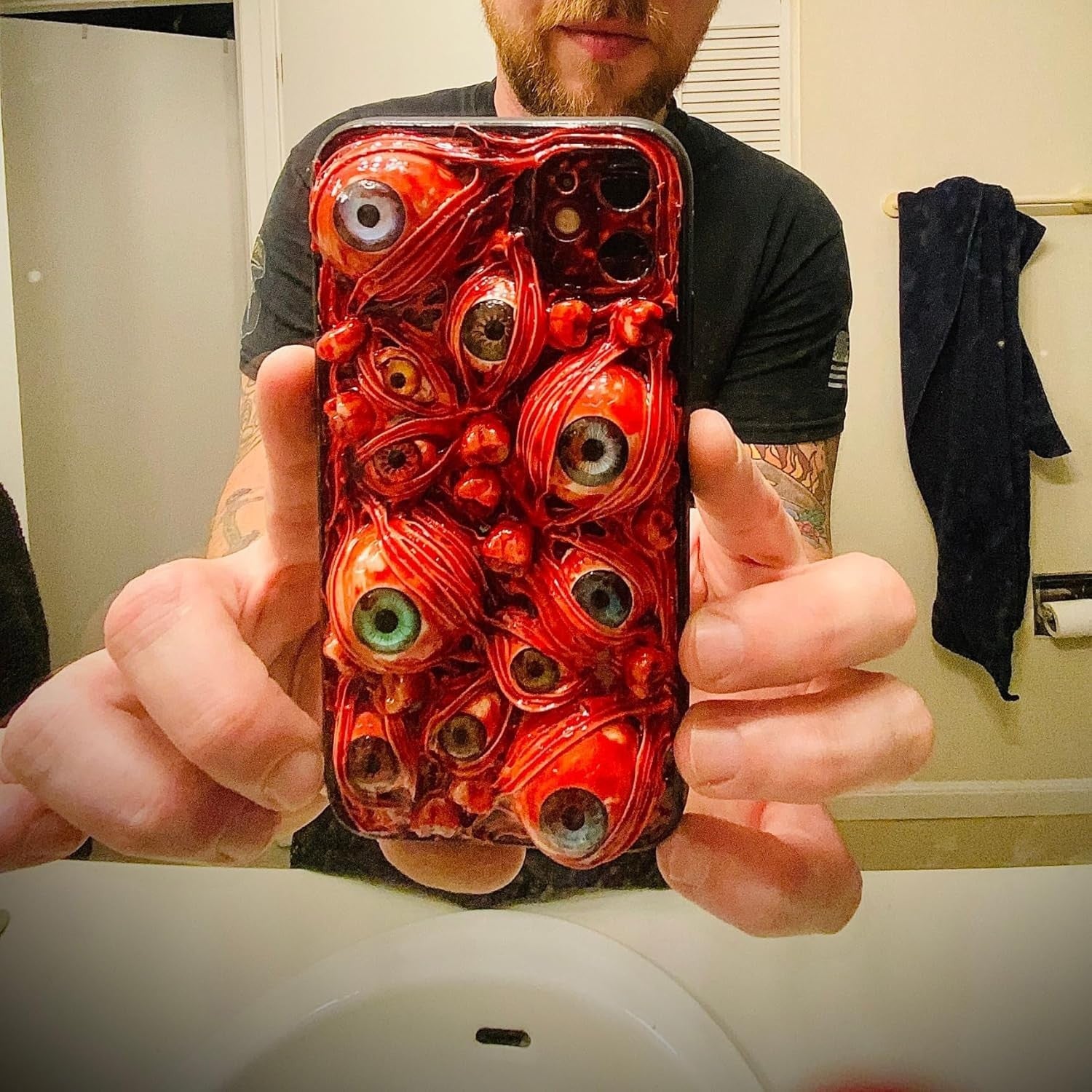 TRADAY scary horror phone case with creepy 3D eyes for iPhone 16 Pro, featuring a dark, horror-themed design.