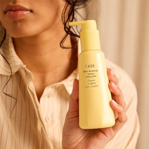 ORIBE Hair Alchemy Heatless Styling Balm in a sleek jar, showcasing the luxurious hair styling product with a modern design.