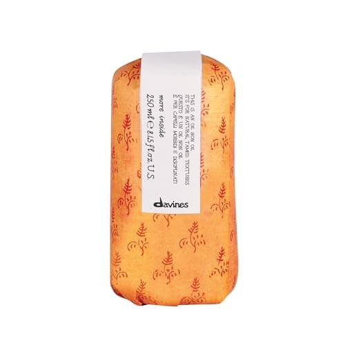 Davines This is an Oil Non Oil bottle showing the product label with a sleek black and white design and liquid inside