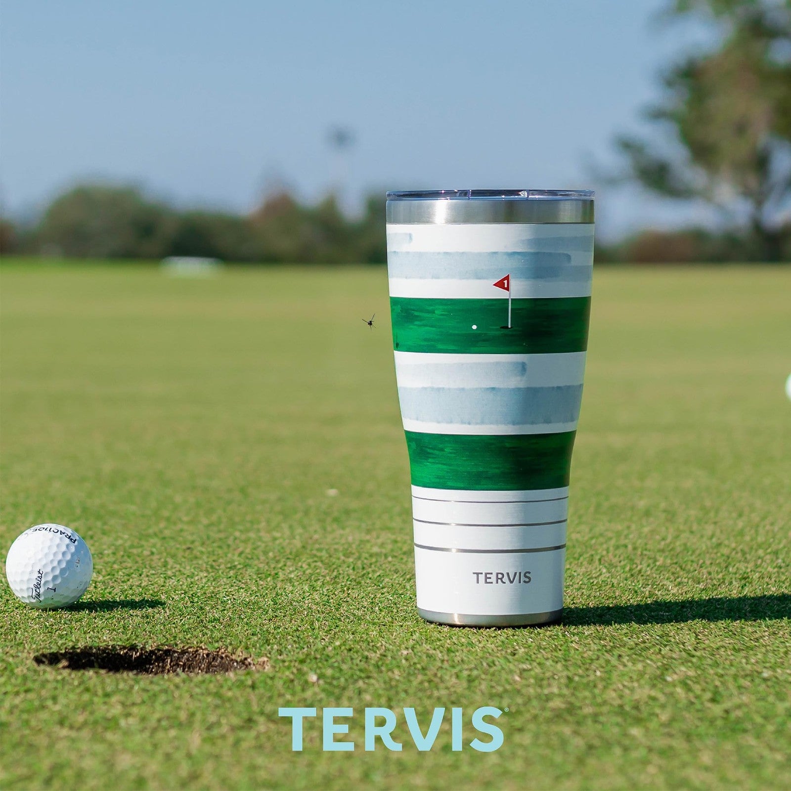 Tervis Traveler Wicked in Gold triple insulated tumbler travel cup with lid, designed for hot and cold beverages.