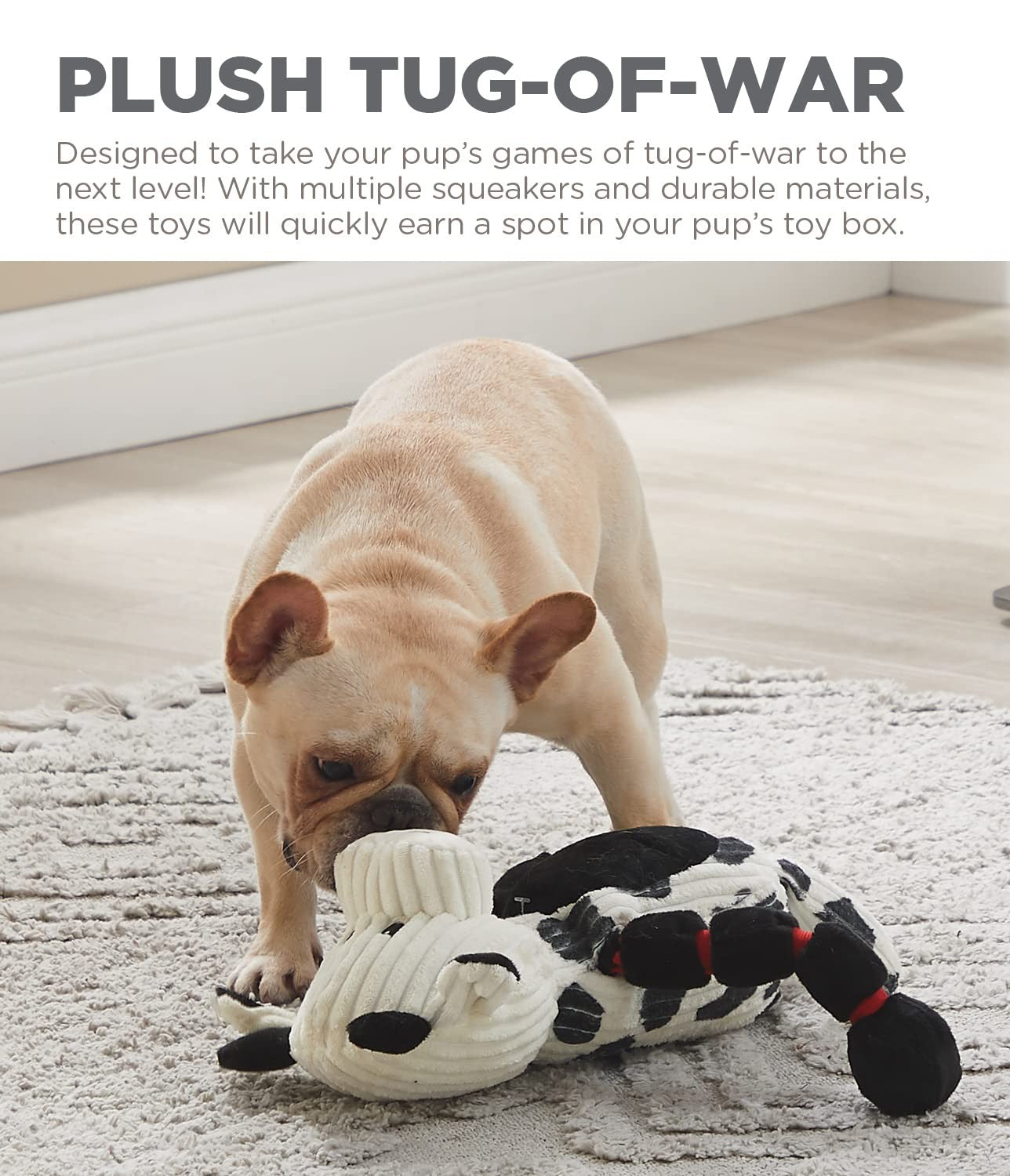 Outward Hound Thunda Tugga Cow plush dog toy with squeaker, featuring a soft stuffed cow design, ideal for tug-of-war play.