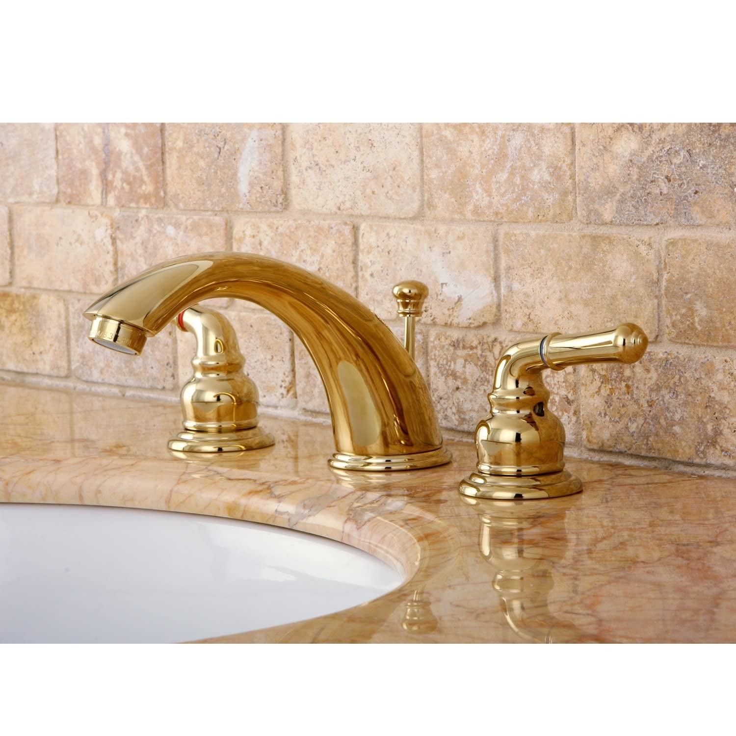 Kingston Brass Magellan widespread bathroom faucet with retail pop-up drain in polished finish, featuring two handles and a sleek spout.