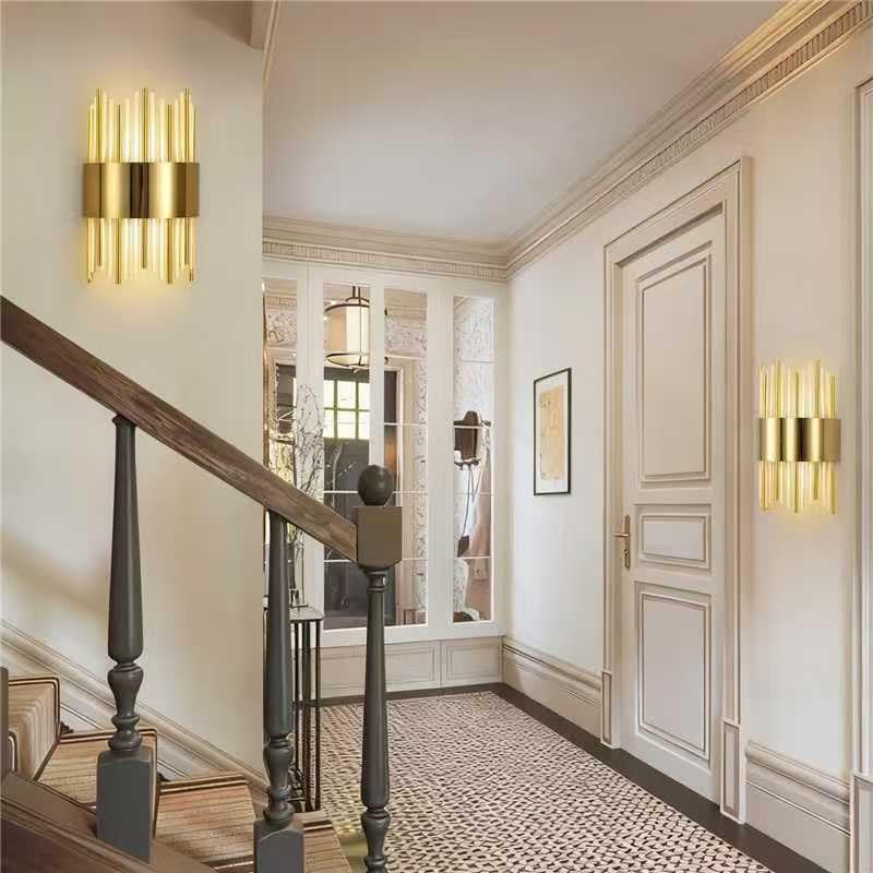 Gold modern wall sconce with LED lighting and crystal accents, dimmable design for stylish interior lighting.