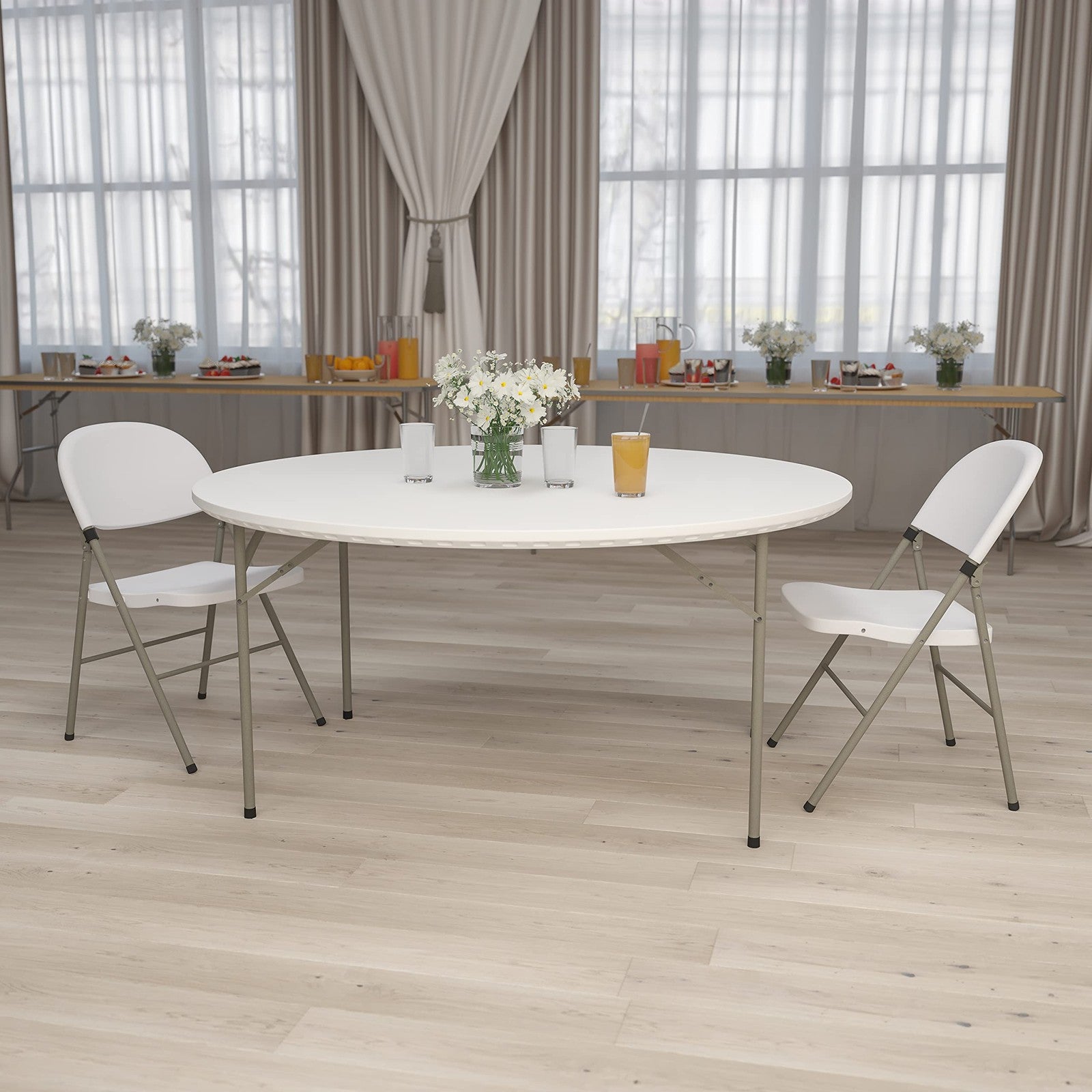 Flash Furniture Kathryn 5-foot round granite white plastic folding table set up on a surface, showcasing its sturdy design and smooth surface.