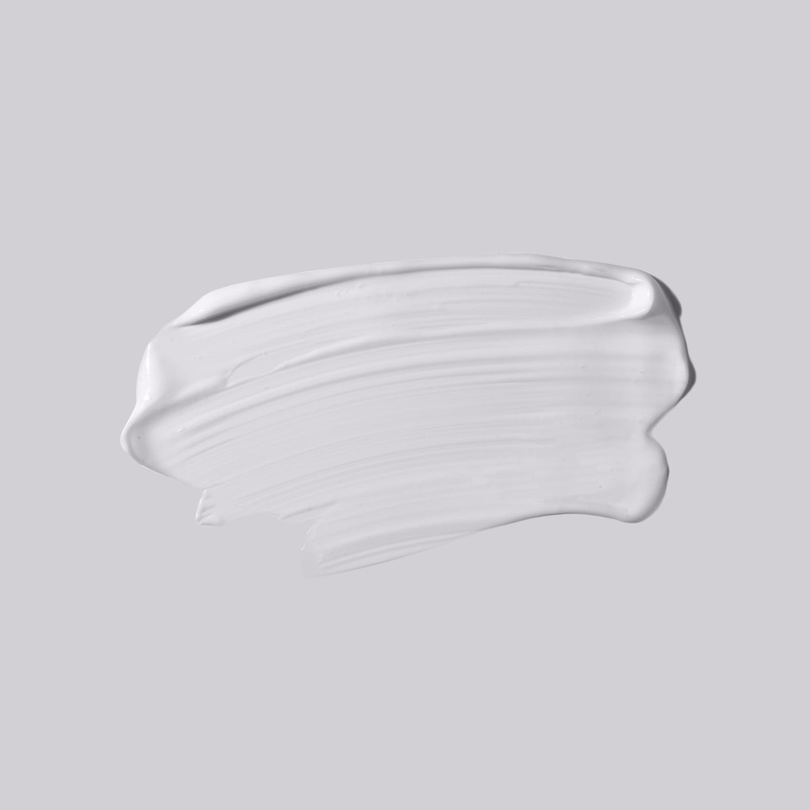 shu uemura art of hair Essence Absolue Nourishing Universal Balm jar, creamy balm with gold accents and product label visible