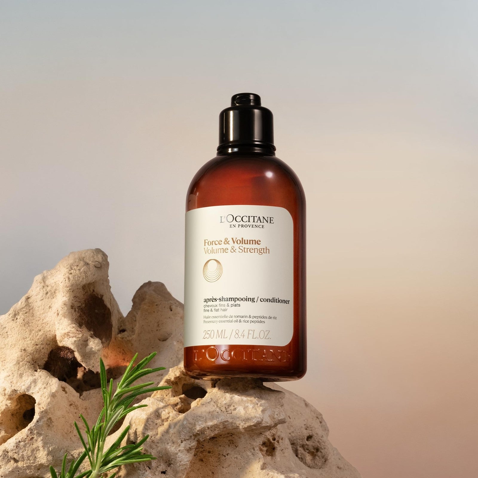 L'Occitane Aromachologie Volume & Strength Conditioner bottle with label, 16.9 fl oz, for nourishing and strengthening hair.