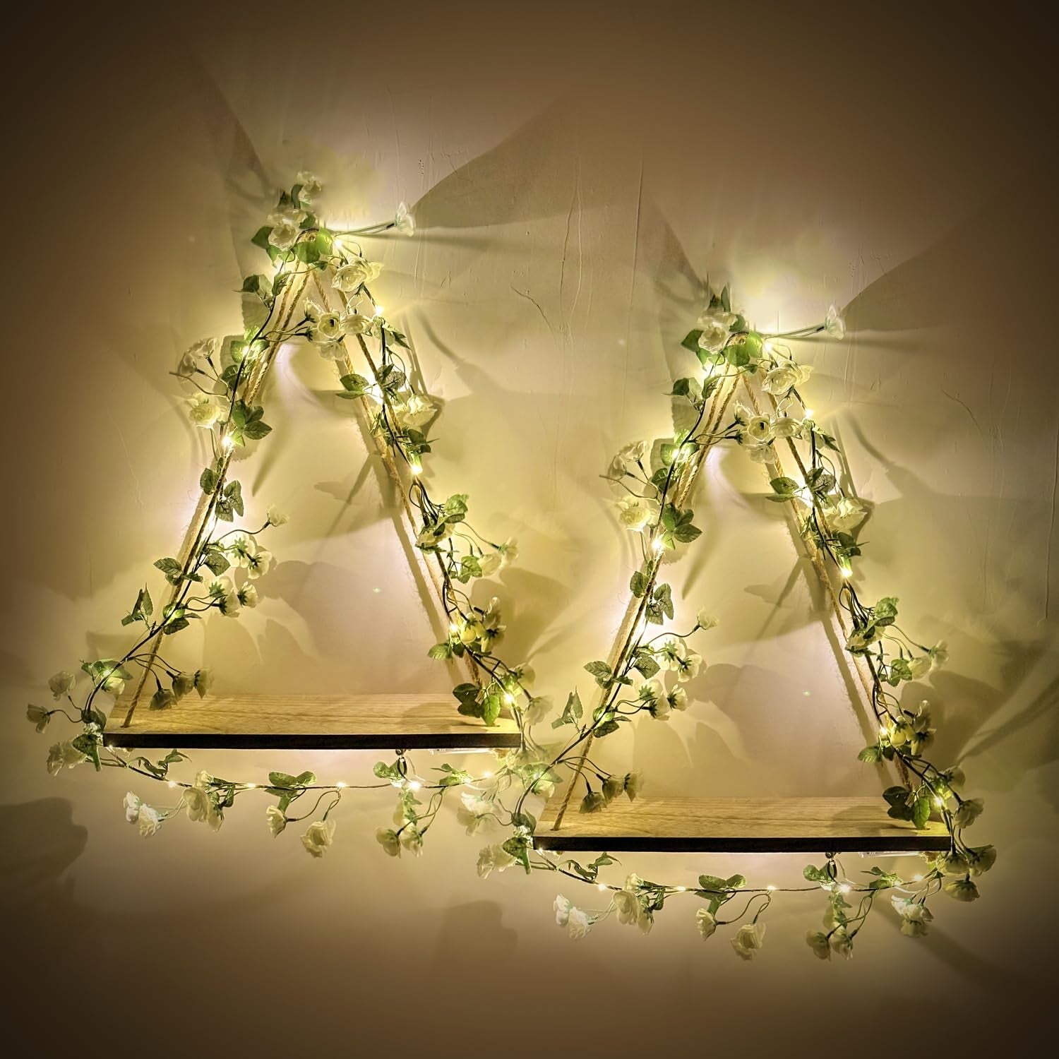 Artificial white flower garland with LED strip, wall hanging shelves by RICHER HOUSE, featuring lush flowers and modern display shelves.