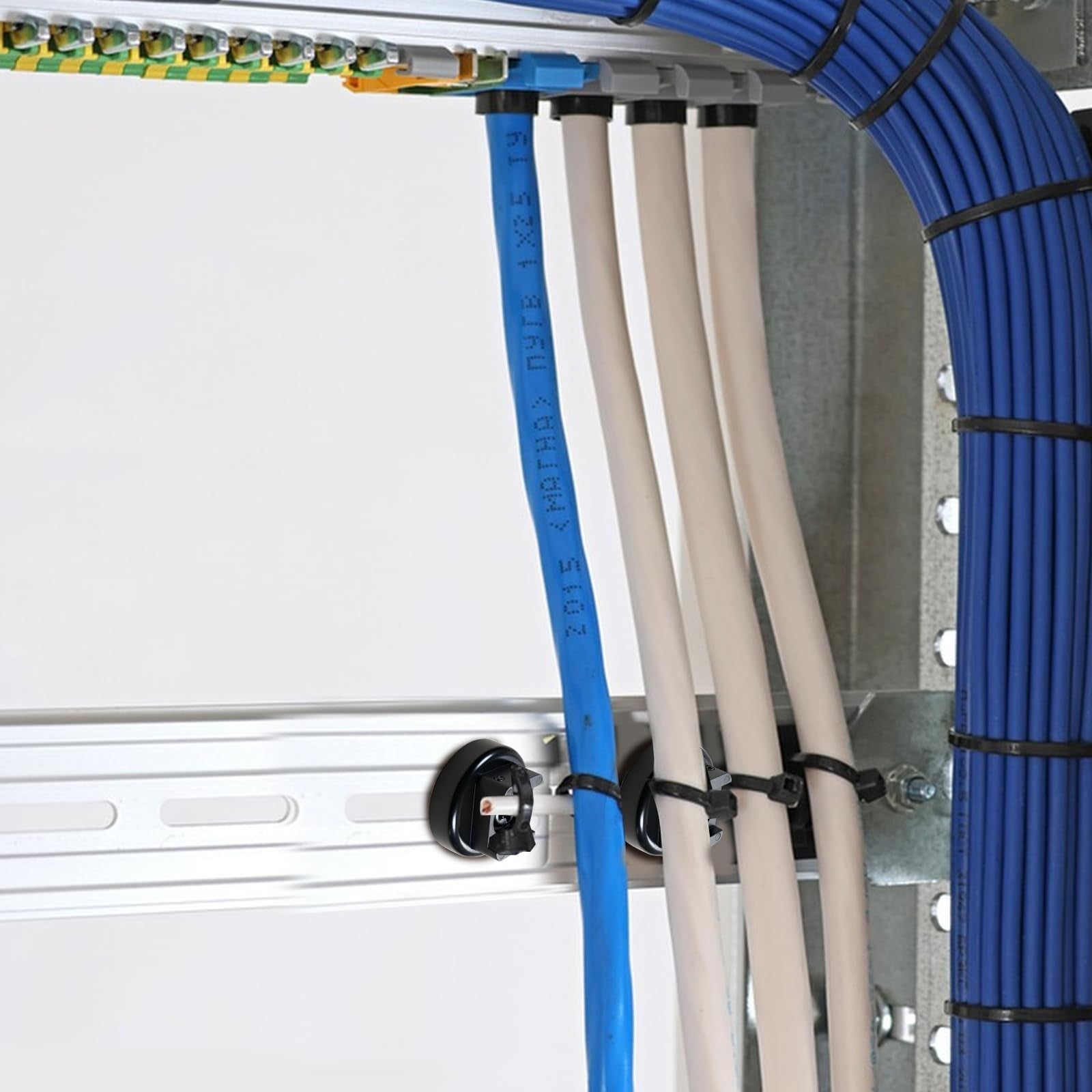 Heavy-duty magnetic cable zip tie base by dcvbny holding wires vertically for secure, multipurpose wire organization and management.