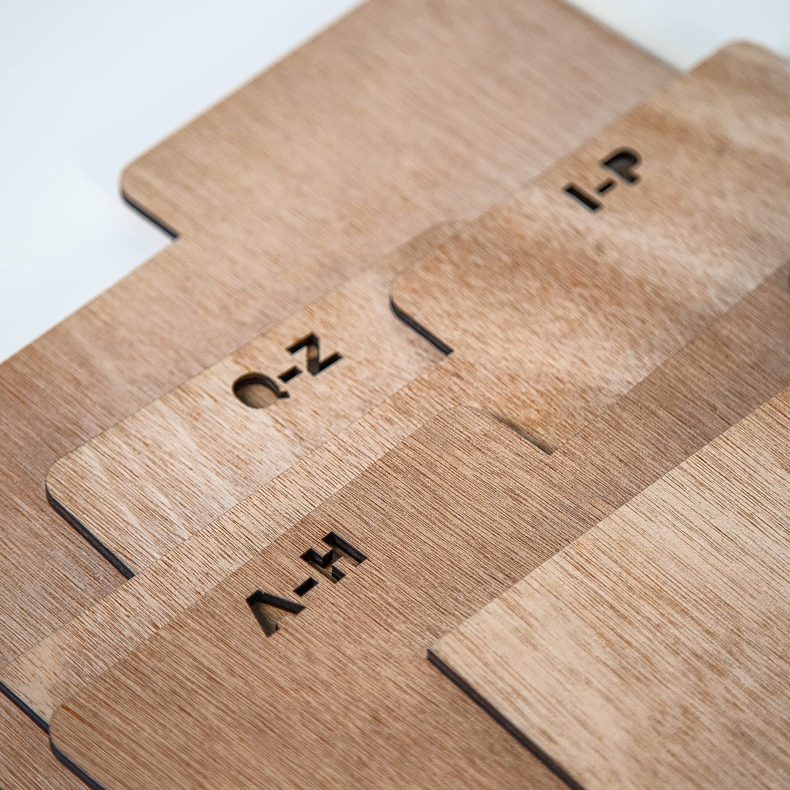 Set of five natural wooden crate dividers by Crosley, showing customizable interior compartments for storage or organization.