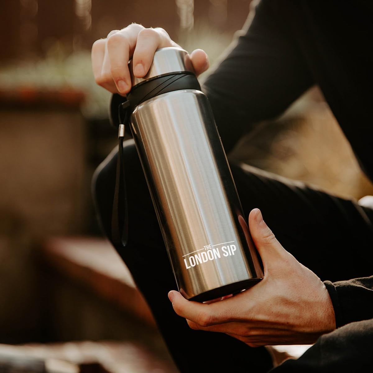 London Sip 25 oz travel mug with tea infuser, stainless steel water bottle, and multi-function design for hot and cold beverages.