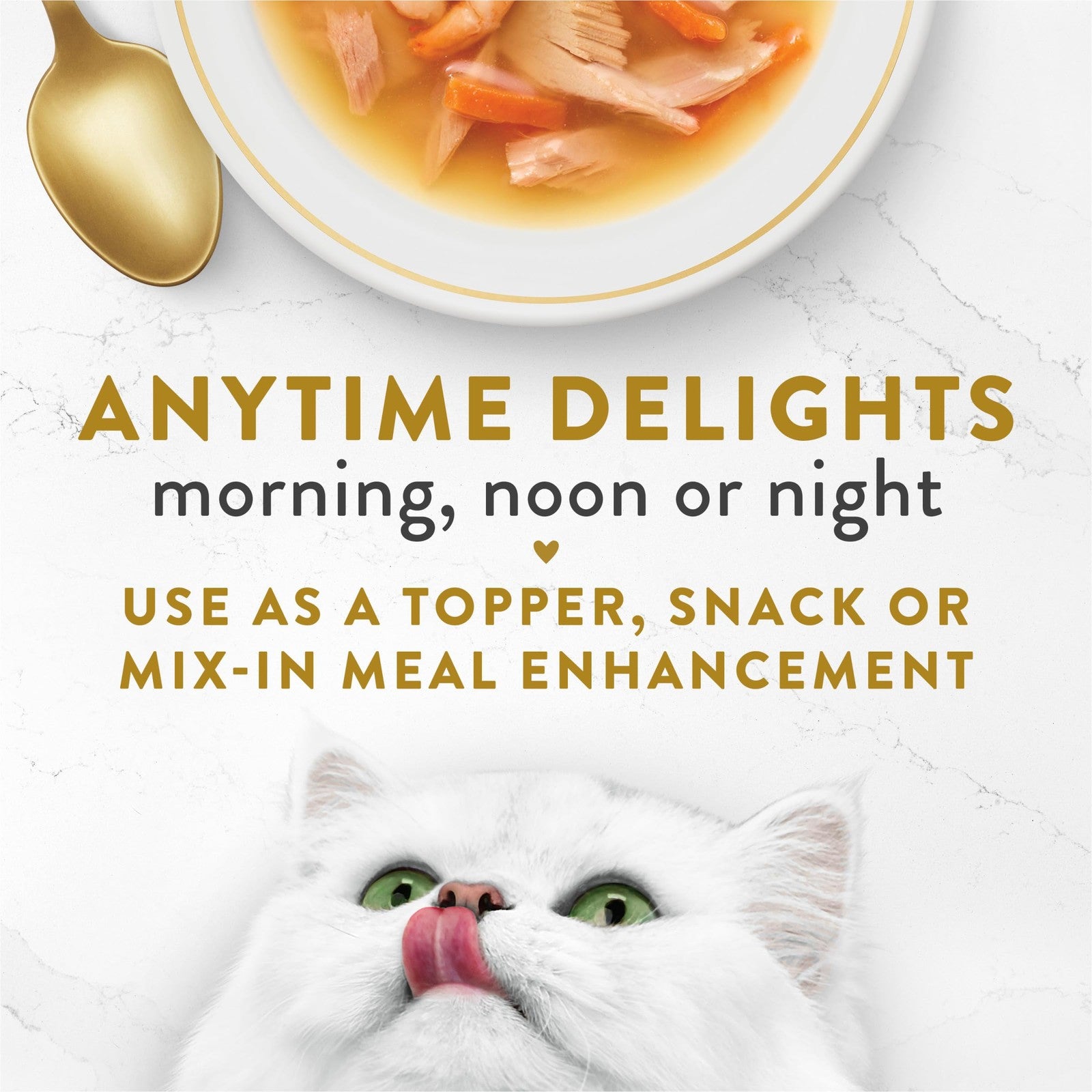 Fancy Feast Broth Complement Chicken and Seafood lickable grain-free wet cat food in a clear bowl with broth and shredded ingredients