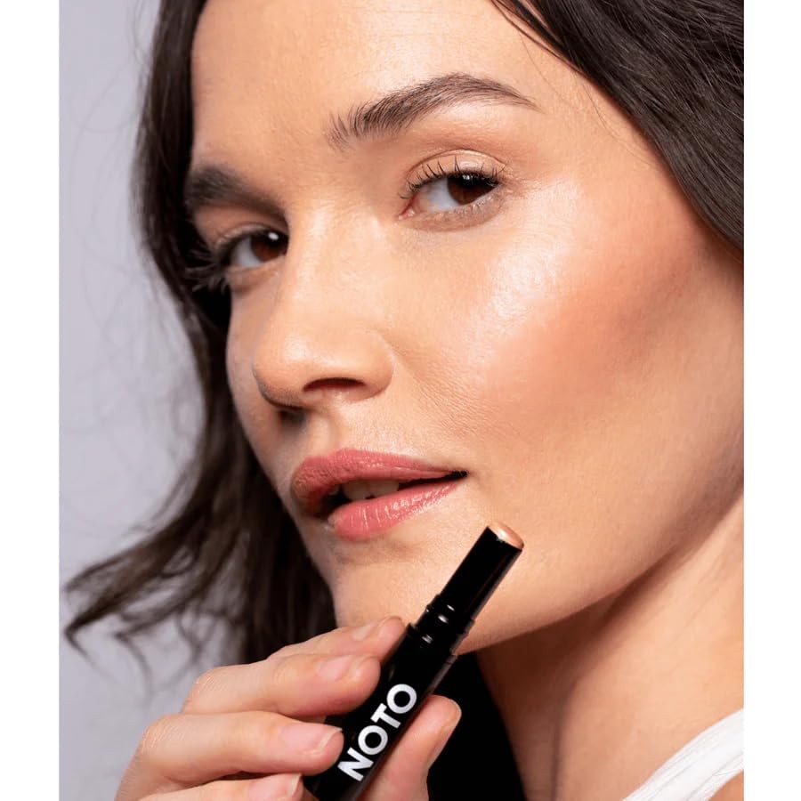 NOTO Botanics Organic Hydra Highlighter Stick for face and body with natural, non-toxic ingredients and sleek packaging.