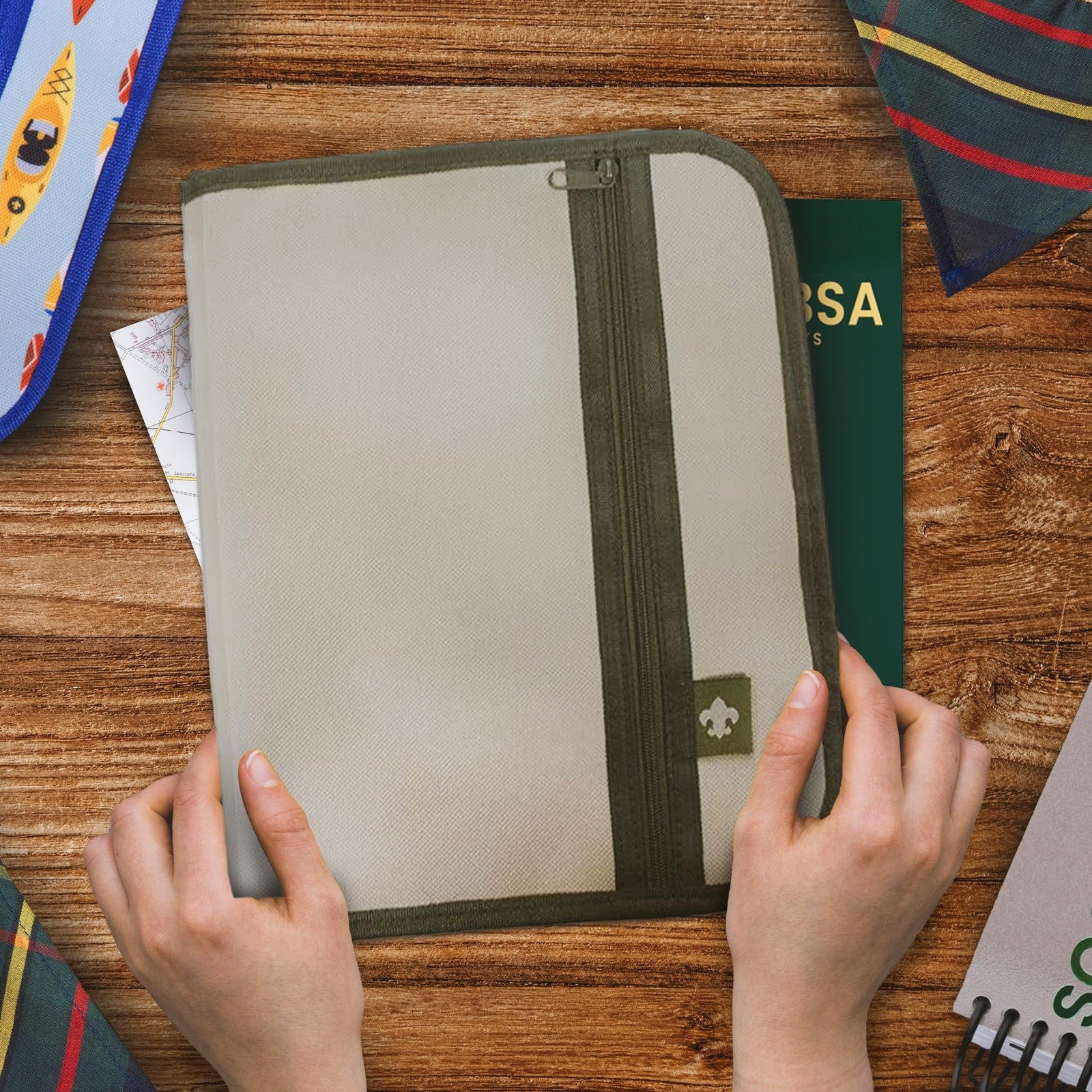 Large tan Boy Scouts of America Scouts BSA handbook cover with embossed emblem and durable material.