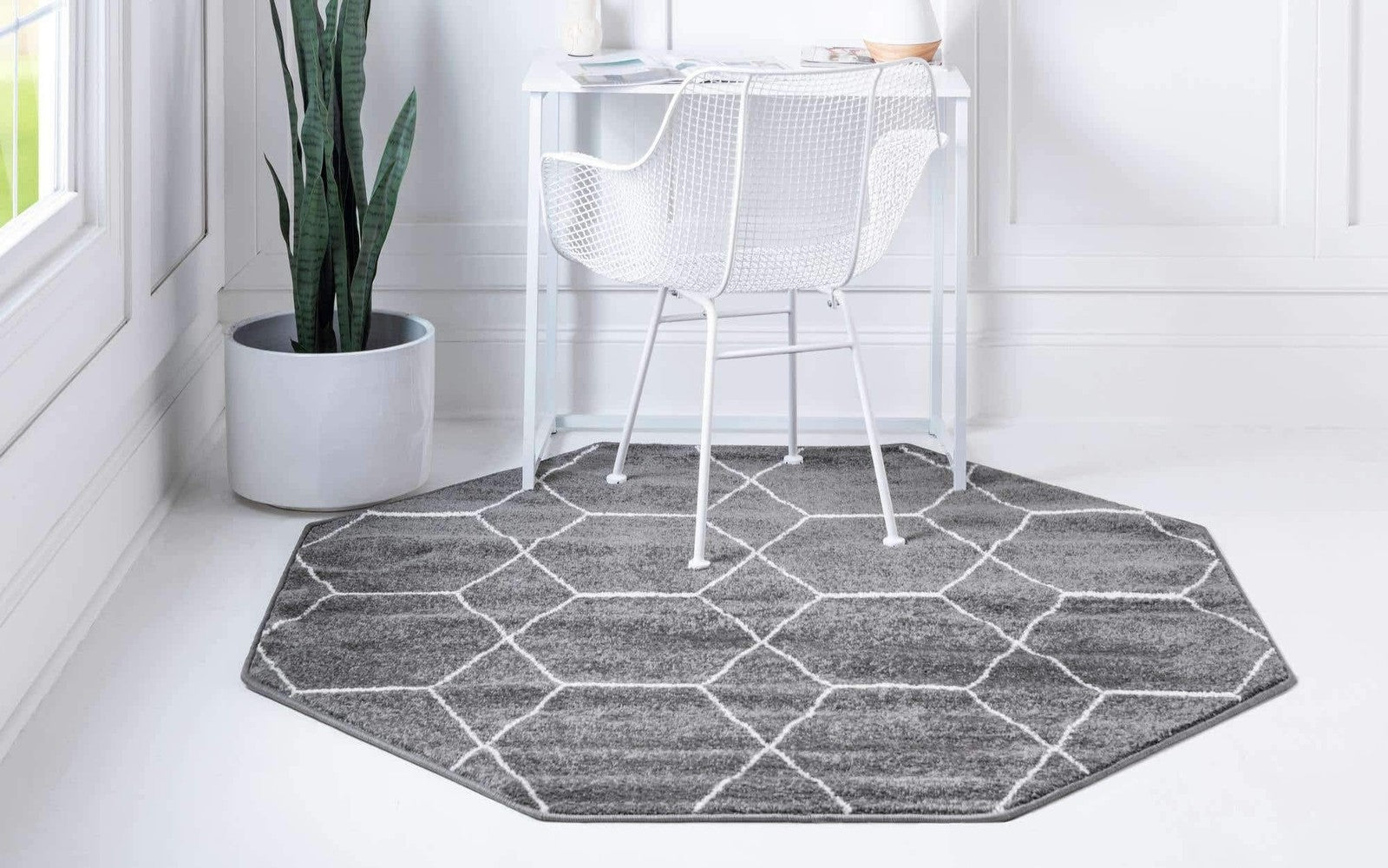 Dark gray geometric area rug from Unique Loom Trellis Frieze Collection featuring a pattern of five octagons on a textured surface.