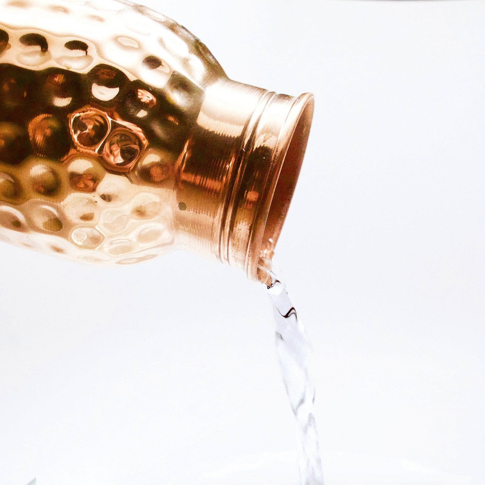 Hammered copper water bottle from Unbranded, pure copper vessel with traditional design for Ayurvedic water storage.