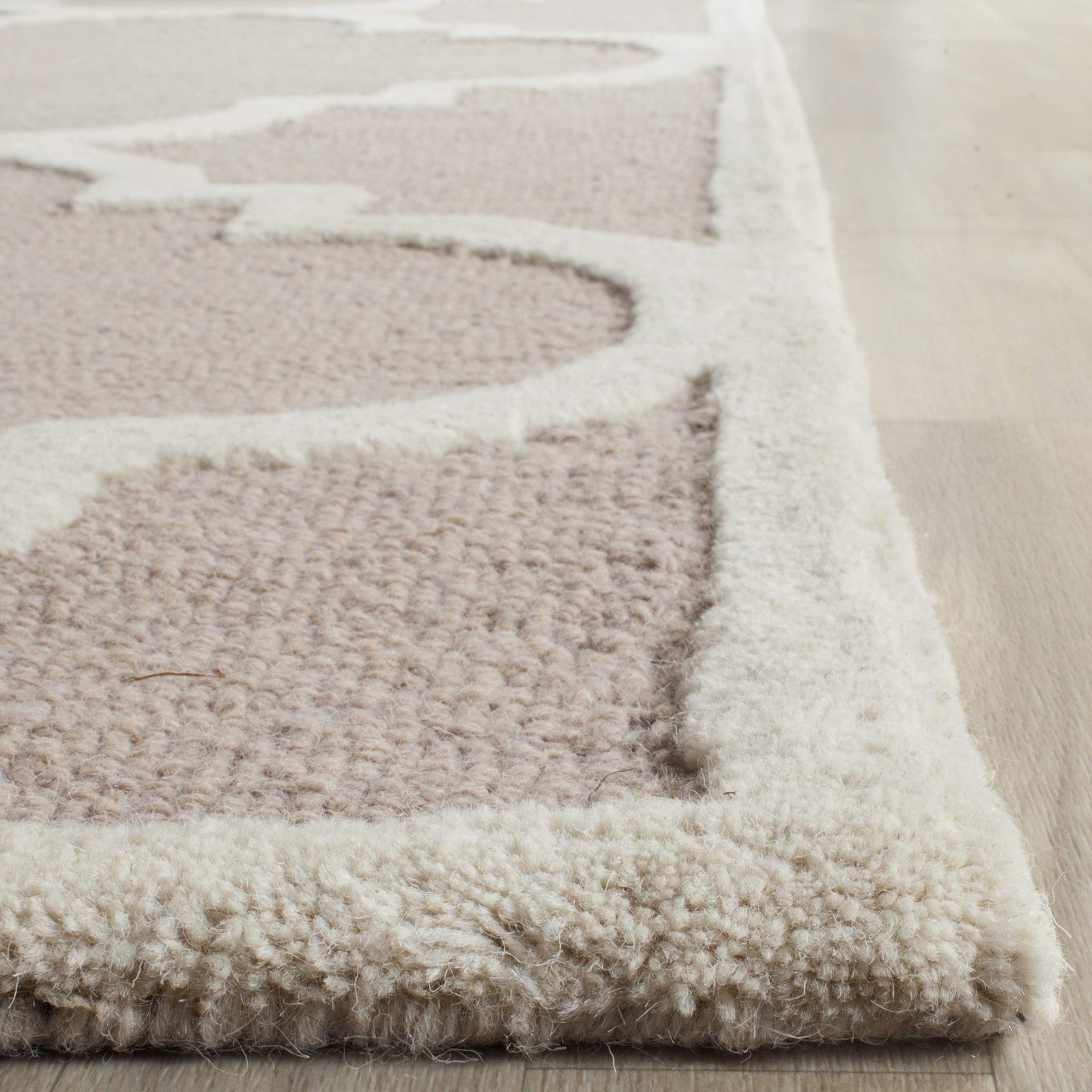 Safavieh Cambridge Collection beige ivory handmade Moroccan area rug, 6 square feet with intricate patterns and soft texture.
