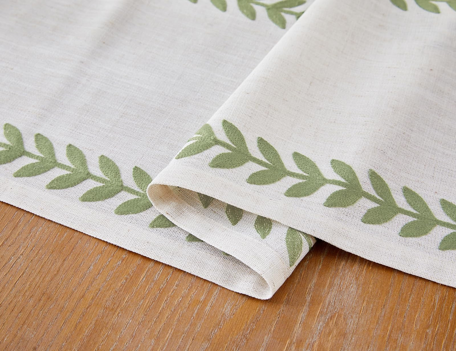 Aoztio rustic embroidered table runner with willow leaf pattern, 13x108 inches, featuring irregular edges and detailed embroidery.