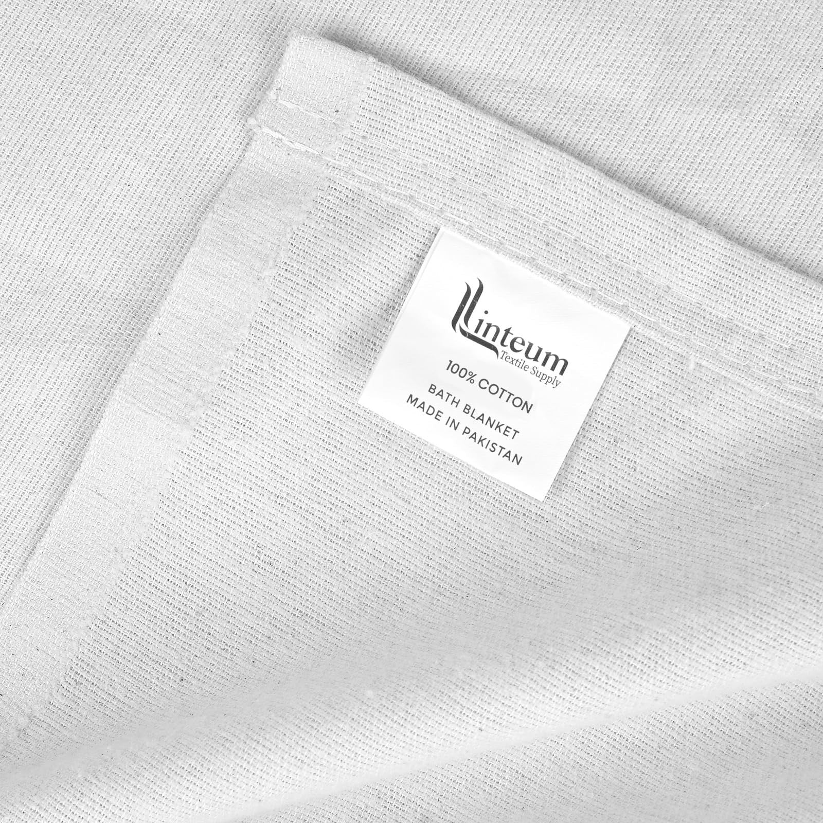White 100% cotton hospital patient bath blanket from Linteum Textile Supply, soft and lightweight for patient comfort.
