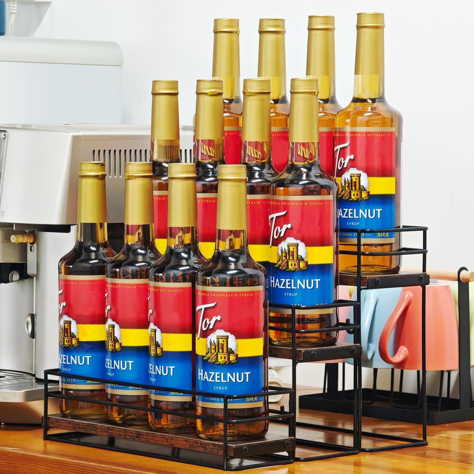 AUATRONNE 12-bottle coffee syrup organizer rack with three-tier stand, holding syrup bottles neatly on a kitchen countertop.