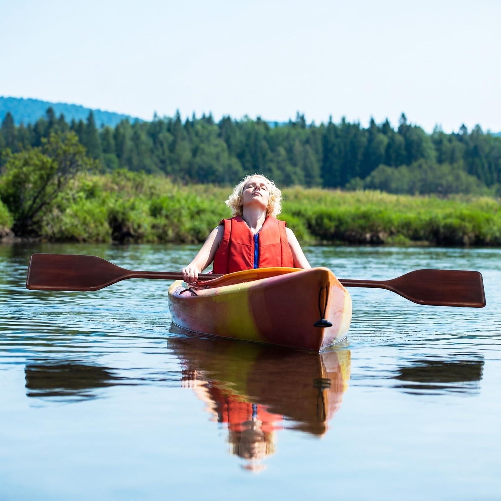 Two Silipull wooden canoe paddles made of solid pine, 2.5 to 4 feet long, with a natural finish and ergonomic handles.