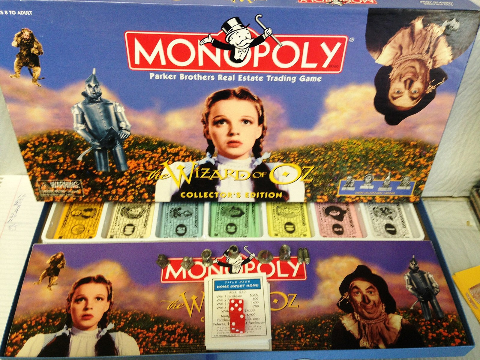 The Wizard of Oz Monopoly game box showing colorful artwork with game pieces and branding for the classic board game.
