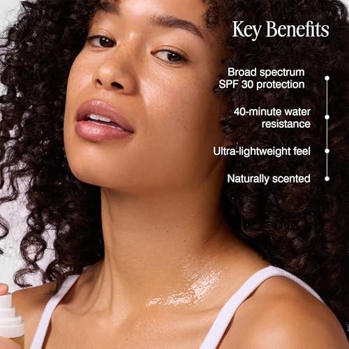 COOLA Firming Body Oil Mist SPF 30, organic lightweight hydrating sunscreen spray with a clear bottle and mist nozzle.